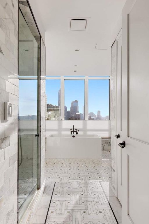 bathroom featuring shower with separate bathtub