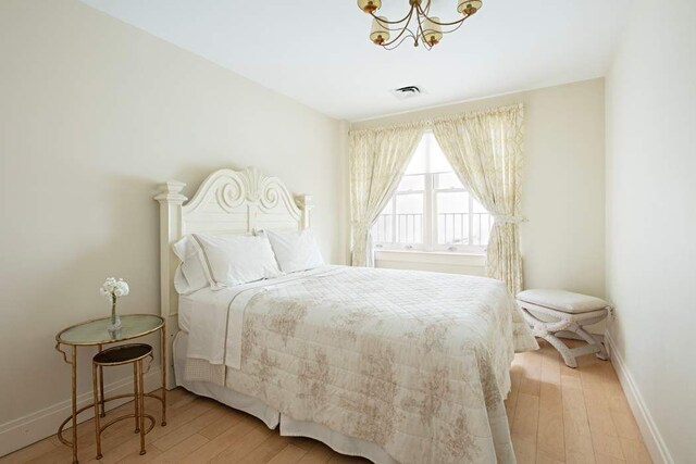 28 Laight St Unit 6Ab, New York City, NY 10013 - bedroom featuring an inviting chandelier and light hardwood / wood-style floors
