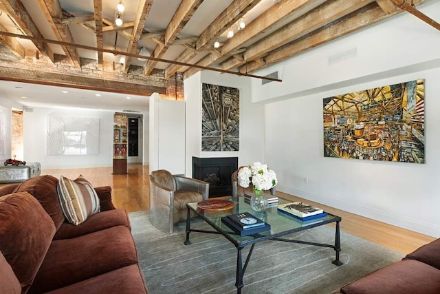 28 Laight St Unit 6Ab, New York City, NY 10013 - living room featuring hardwood / wood-style flooring and beamed ceiling