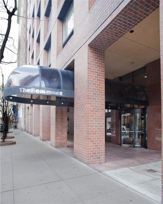 exterior space featuring brick siding