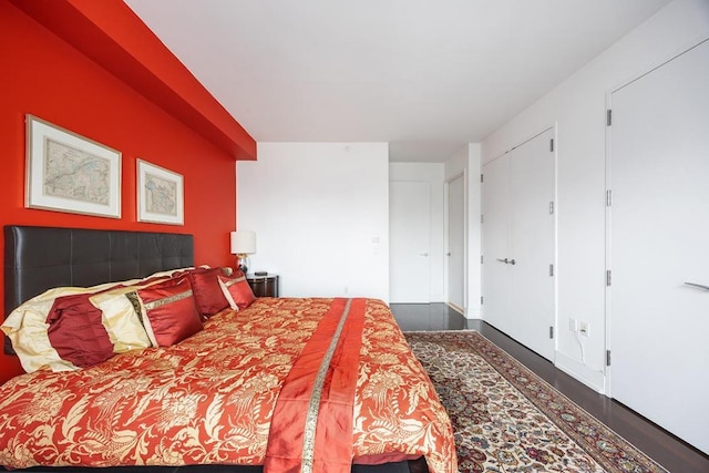 bedroom featuring dark hardwood / wood-style flooring