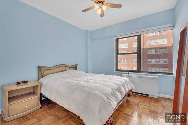 360 E 72nd St Unit B803, New York City, NY 10021 - bedroom featuring radiator heating unit, crown molding, and a ceiling fan