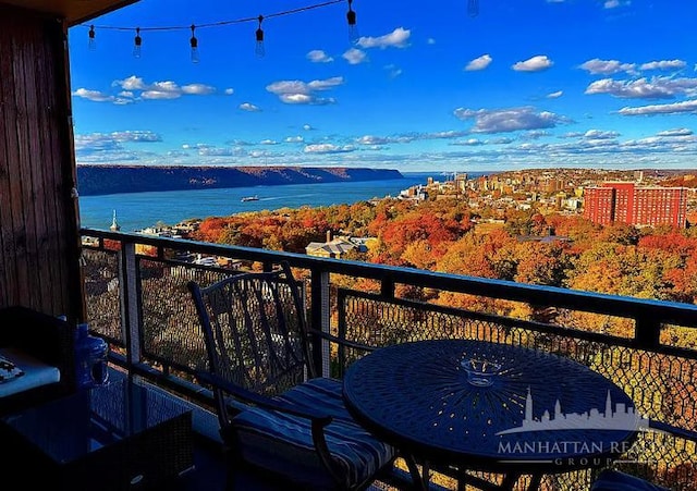 balcony featuring a water view