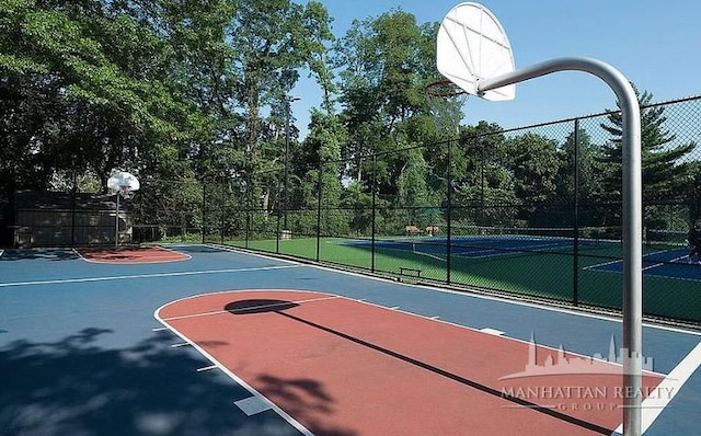 view of sport court featuring community basketball court and fence