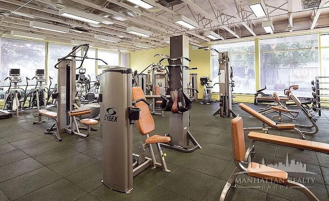 workout area with a wall of windows