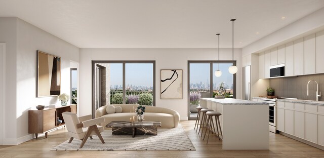 58-01 Queens Blvd Unit 2-E, New York City, NY 11377 - living area with healthy amount of natural light, light wood-style flooring, recessed lighting, and baseboards