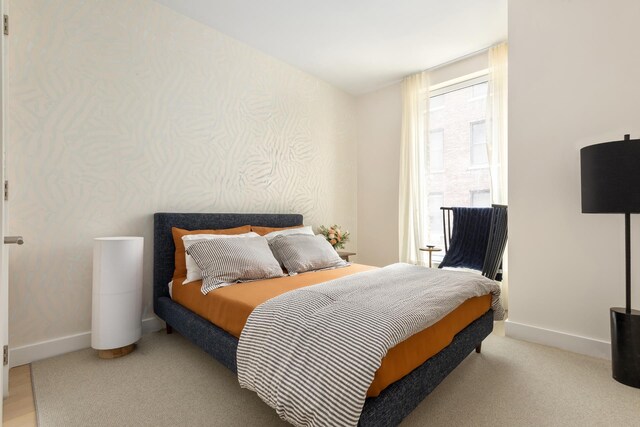 215 W 28th St Unit 2C, New York City, NY 10001 - carpeted bedroom with baseboards
