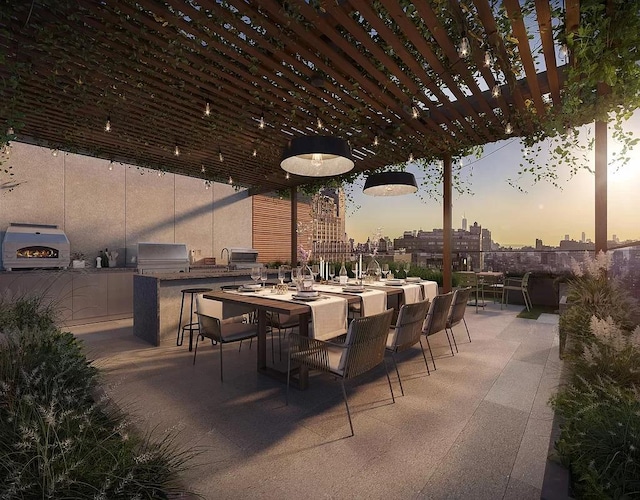 view of patio featuring an outdoor kitchen, a pergola, outdoor dining area, and a grill