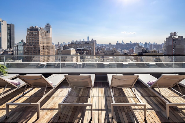 wooden terrace featuring a city view