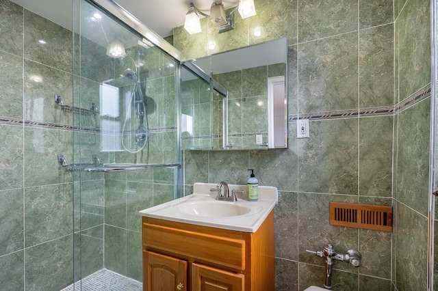 3725 Henry Hudson Pkwy W Unit 6-D, New York City, NY 10463 - full bathroom with vanity, a shower stall, and tile walls