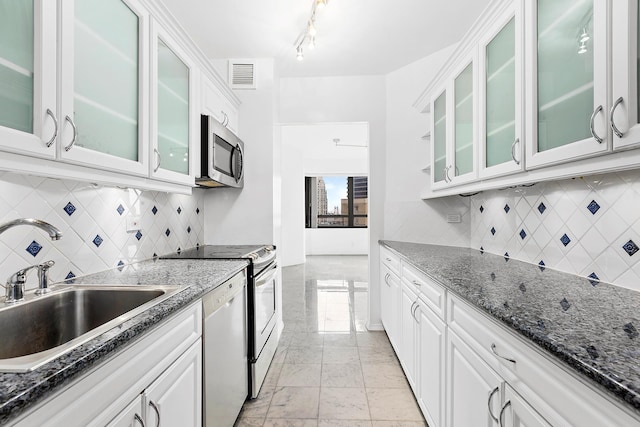 kitchen featuring visible vents, dishwasher, stainless steel microwave, white cabinetry, and a sink