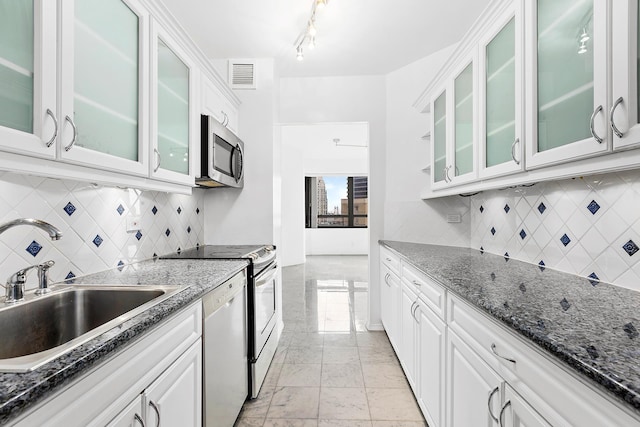 kitchen featuring a sink, dishwasher, marble finish floor, stainless steel microwave, and visible vents