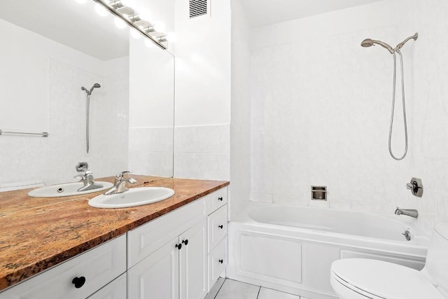 full bathroom with vanity, toilet, tile patterned floors, and tiled shower / bath