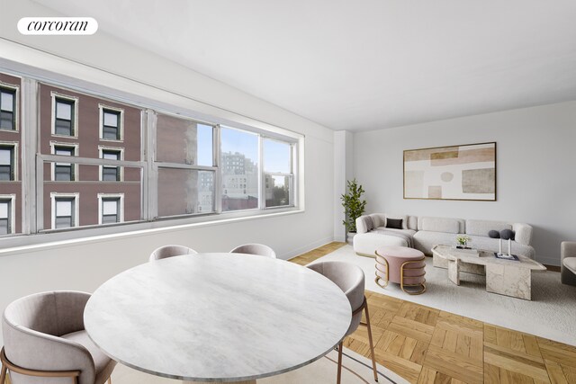 dining room featuring light parquet flooring