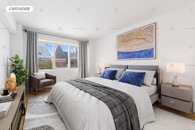 bedroom featuring visible vents and wood finished floors