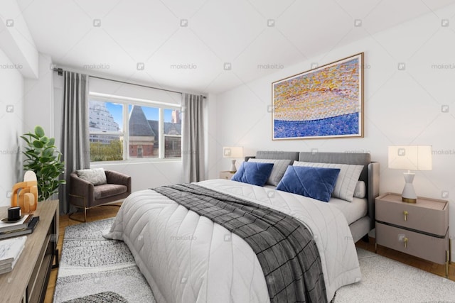 bedroom featuring wood finished floors