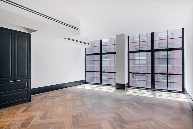 spare room featuring light parquet floors