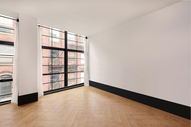 empty room with light parquet flooring