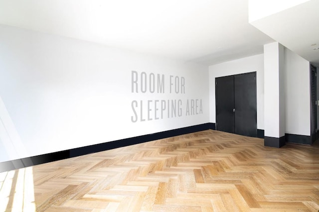 empty room with light parquet flooring