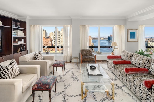 interior space with ornamental molding, a water view, and plenty of natural light