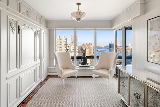 sunroom / solarium featuring a city view and plenty of natural light