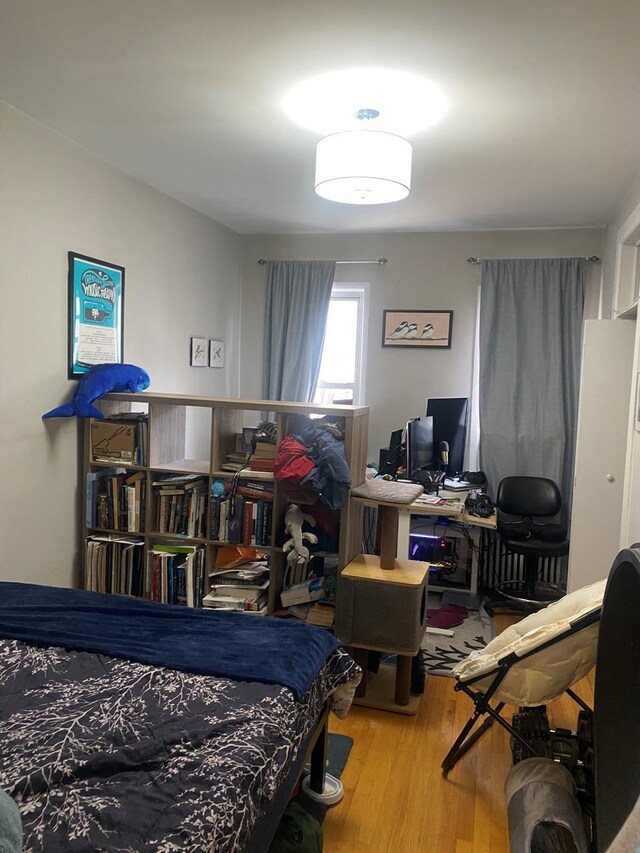 bedroom with wood finished floors