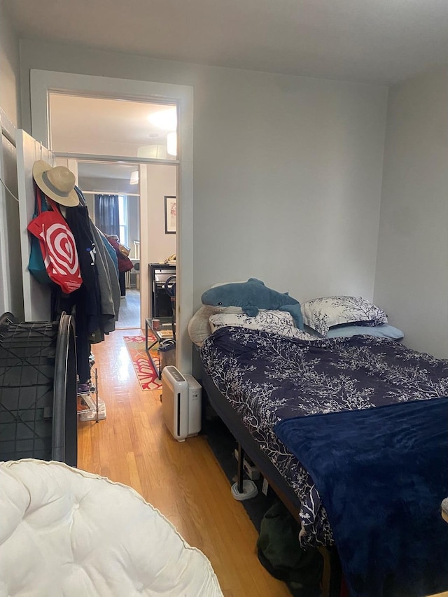 bedroom with wood finished floors