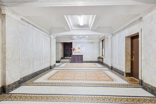 hallway with beamed ceiling, coffered ceiling, and crown molding