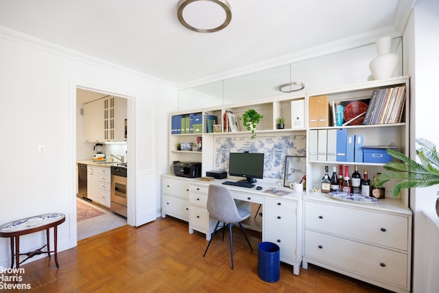 office space featuring parquet floors, crown molding, and sink