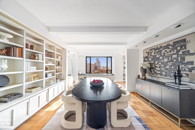 dining room with beam ceiling