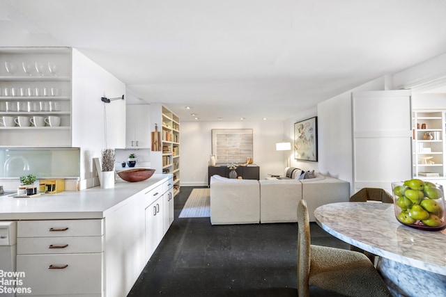 kitchen featuring white cabinetry, light countertops, dark wood-style floors, and open floor plan