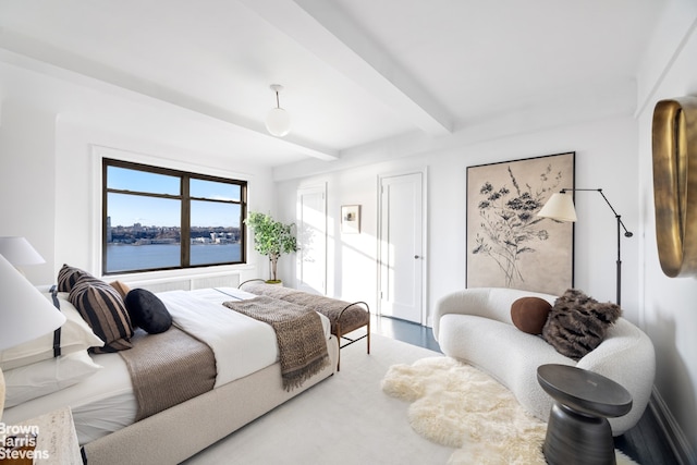 bedroom featuring beamed ceiling