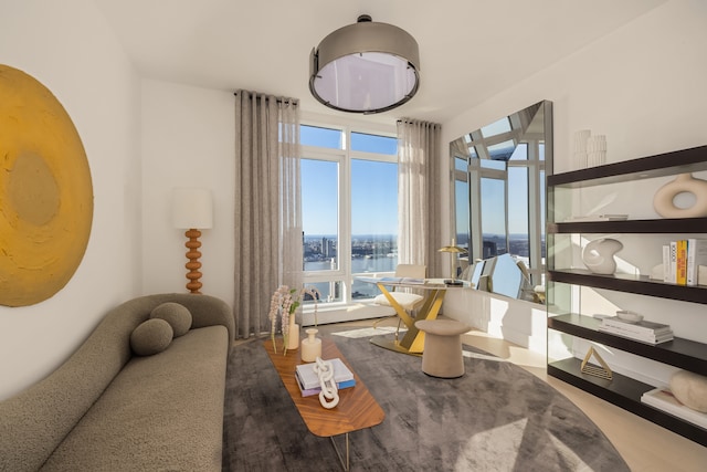 interior space with wood finished floors and a water view
