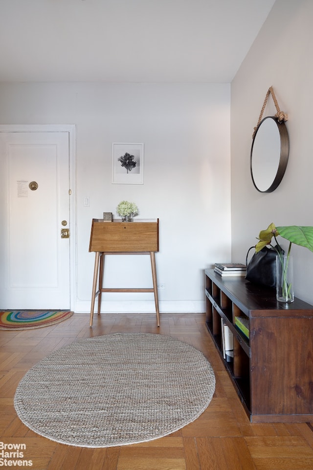 entrance foyer featuring baseboards