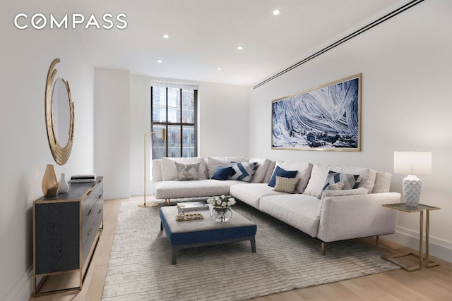 living room with light hardwood / wood-style flooring