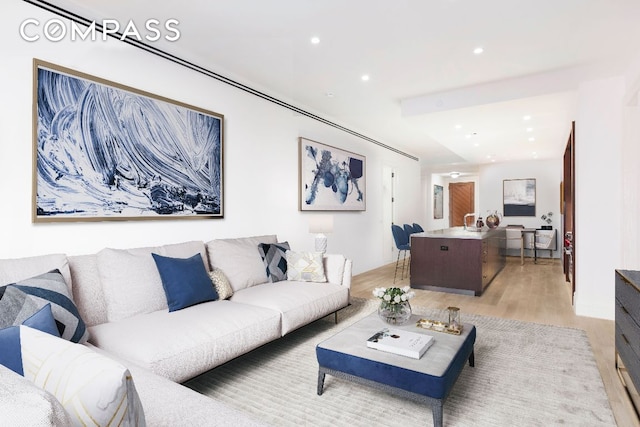 living room with light hardwood / wood-style flooring