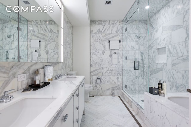 full bathroom featuring vanity, separate shower and tub, tile walls, and toilet