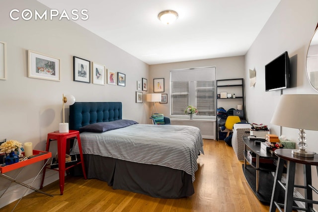 bedroom with wood finished floors