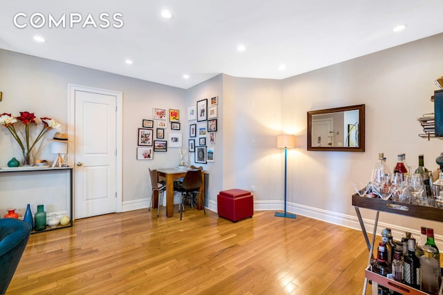 miscellaneous room with light wood-style floors, baseboards, and recessed lighting