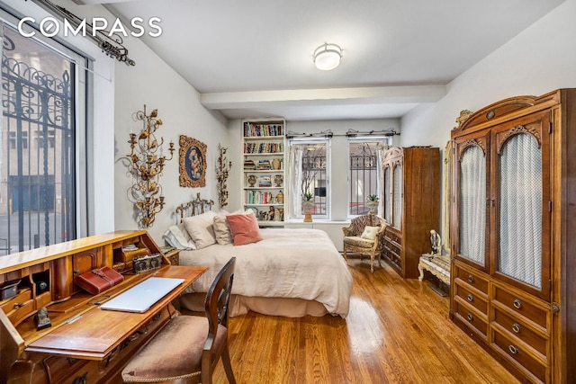 bedroom with hardwood / wood-style floors