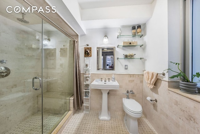 bathroom featuring walk in shower, toilet, and tile walls