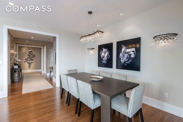 dining space featuring recessed lighting, baseboards, and wood finished floors