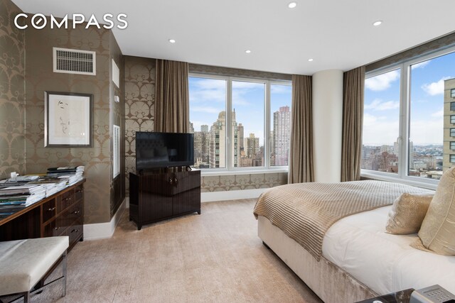 bedroom featuring recessed lighting, visible vents, multiple windows, and wallpapered walls