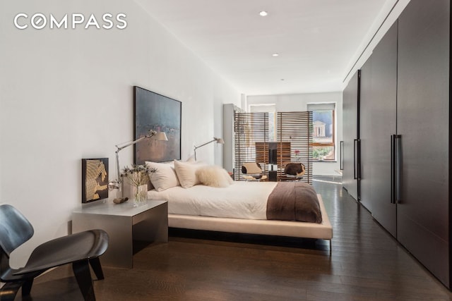 bedroom featuring dark hardwood / wood-style floors