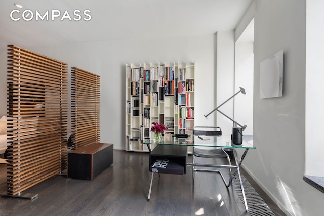 office featuring baseboards and wood finished floors