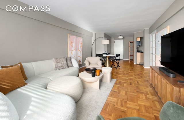 living room featuring light parquet floors