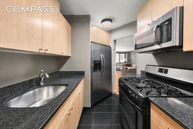 420 E 64th St Unit E3A, New York City, NY 10065 - kitchen featuring stainless steel appliances, light brown cabinets, a sink, and dark stone counters