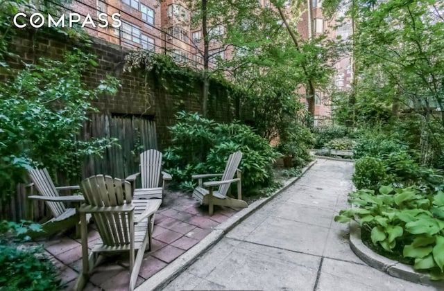 surrounding community with a patio area and fence