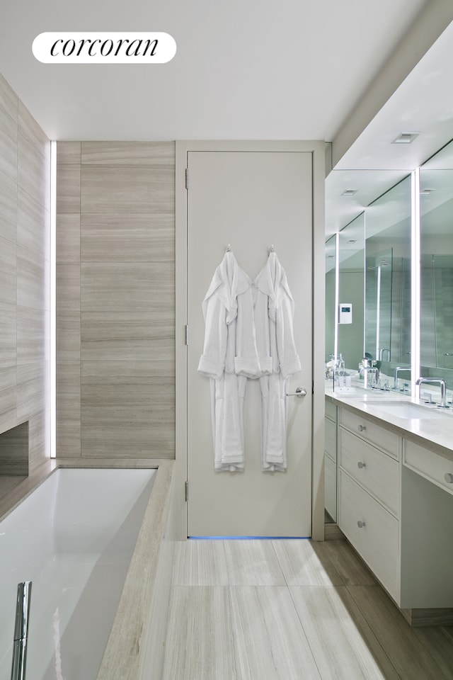 211 Madison Ave Unit 16B, New York City, NY 10016 - full bath featuring vanity and a garden tub