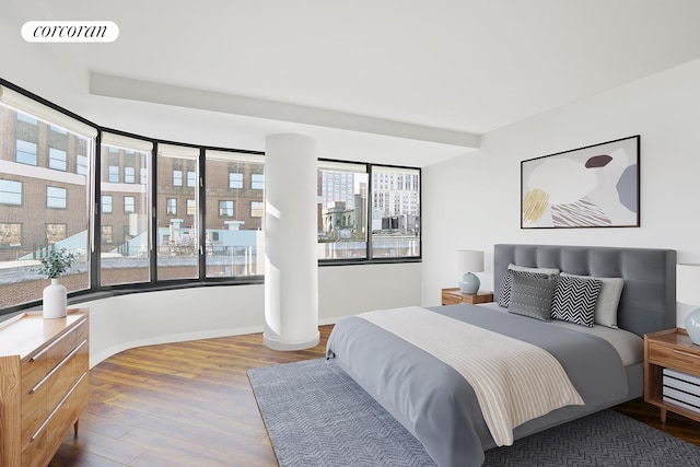 211 Madison Ave Unit 16B, New York City, NY 10016 - bedroom with multiple windows, wood finished floors, and baseboards